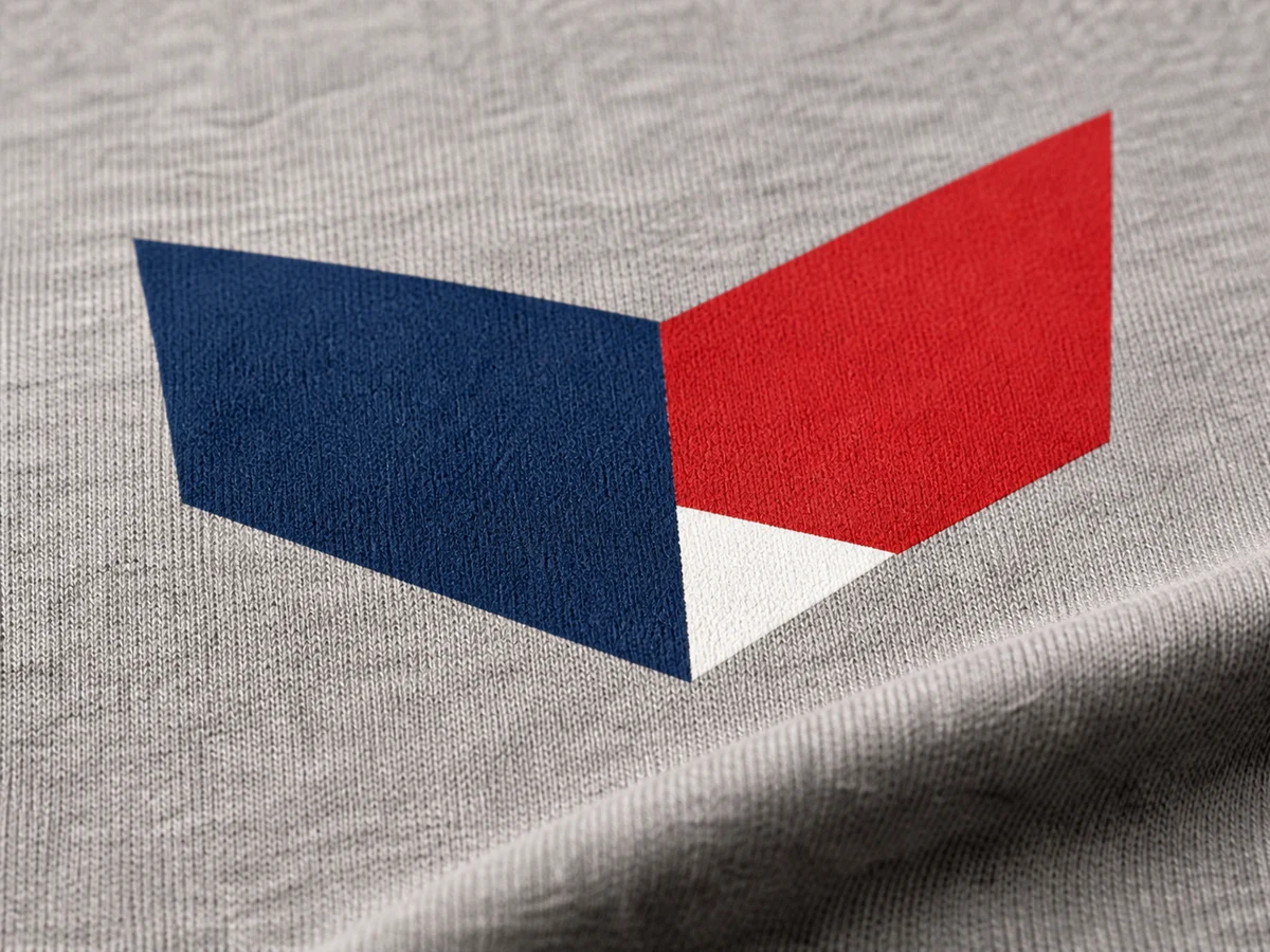 Close-up of crisp red and navy screen-print ink on heather-gray cotton