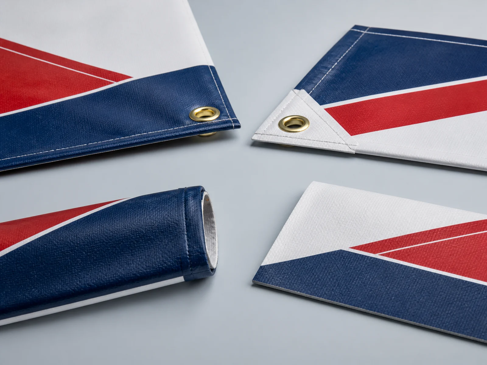 Close up of a hemmed banner edge with metal grommets