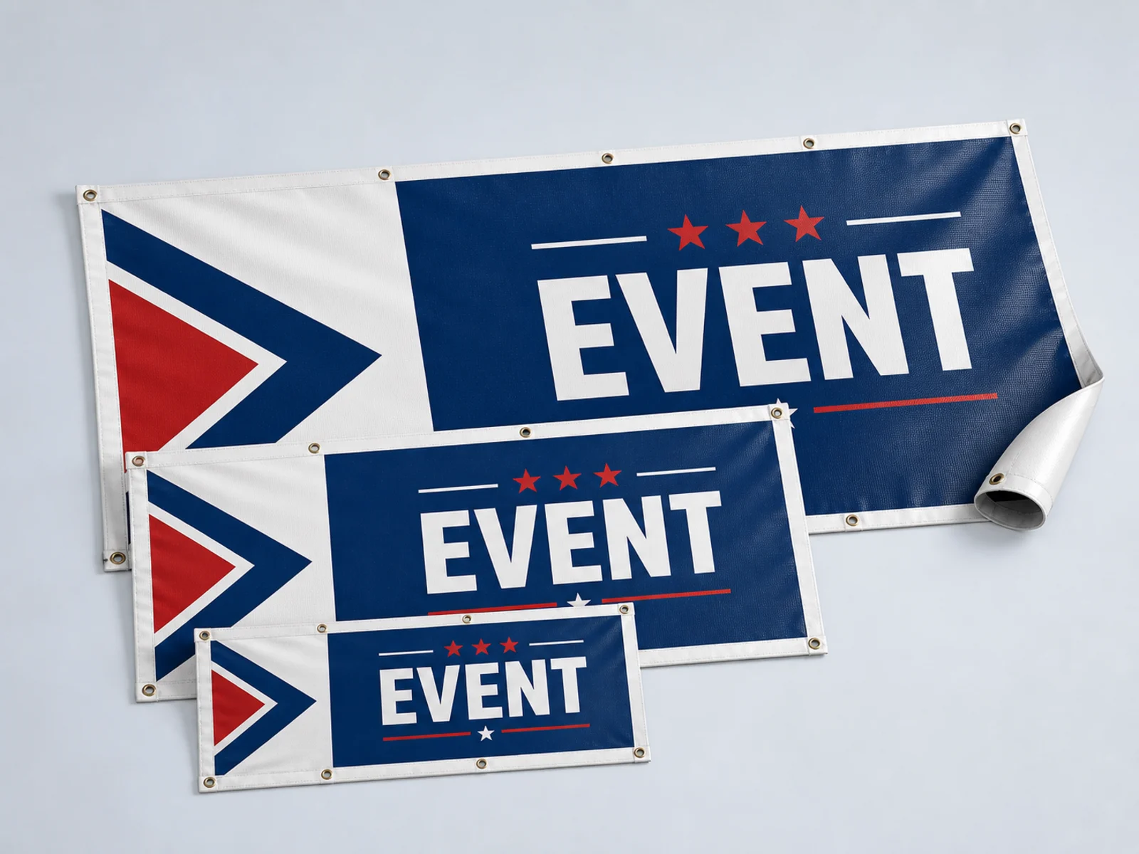 Three vinyl banners of different widths, one unrolled to show the printed face