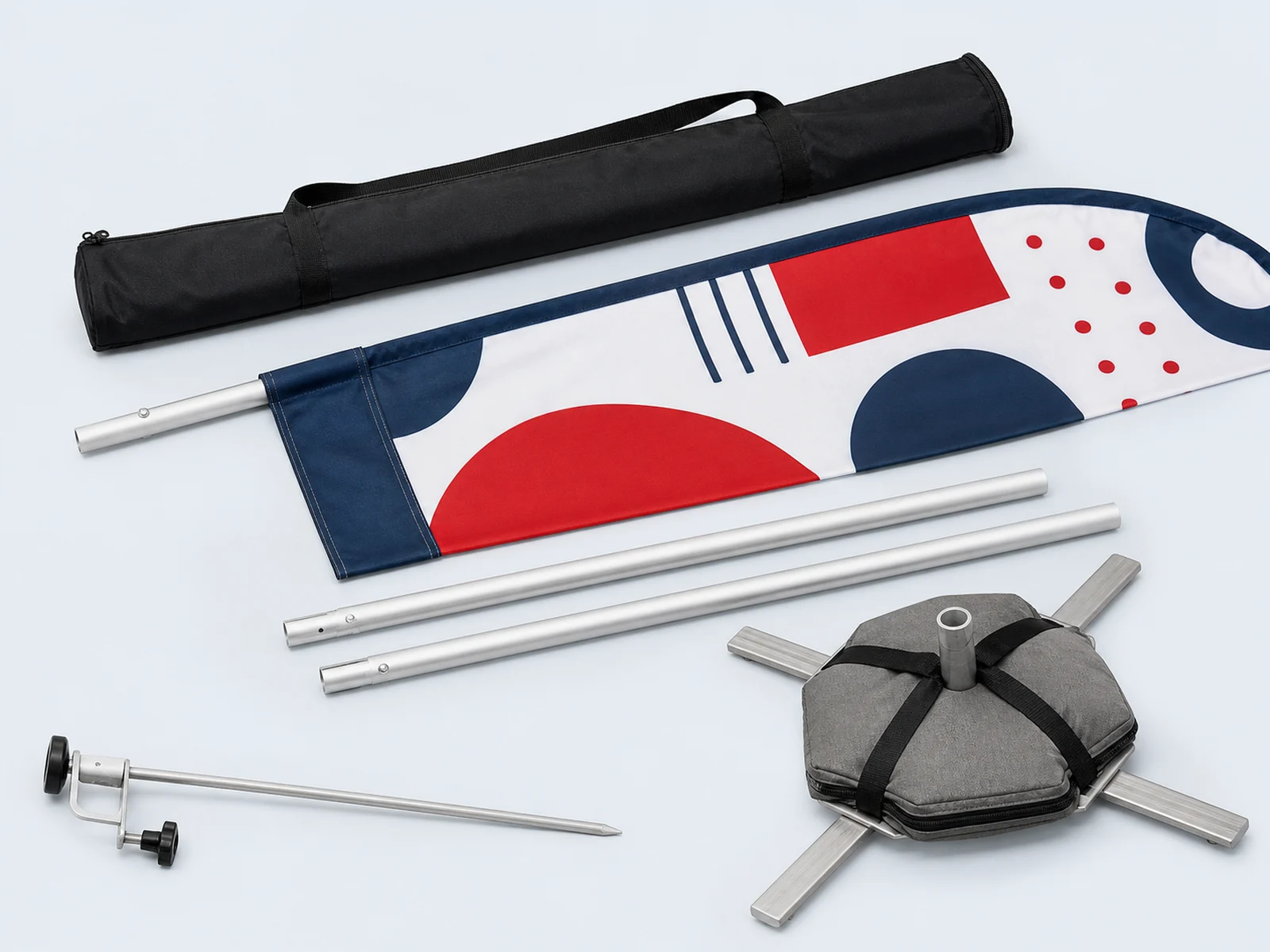 Sectional poles, a ground spike, a cross base with a water bag, and a carry bag