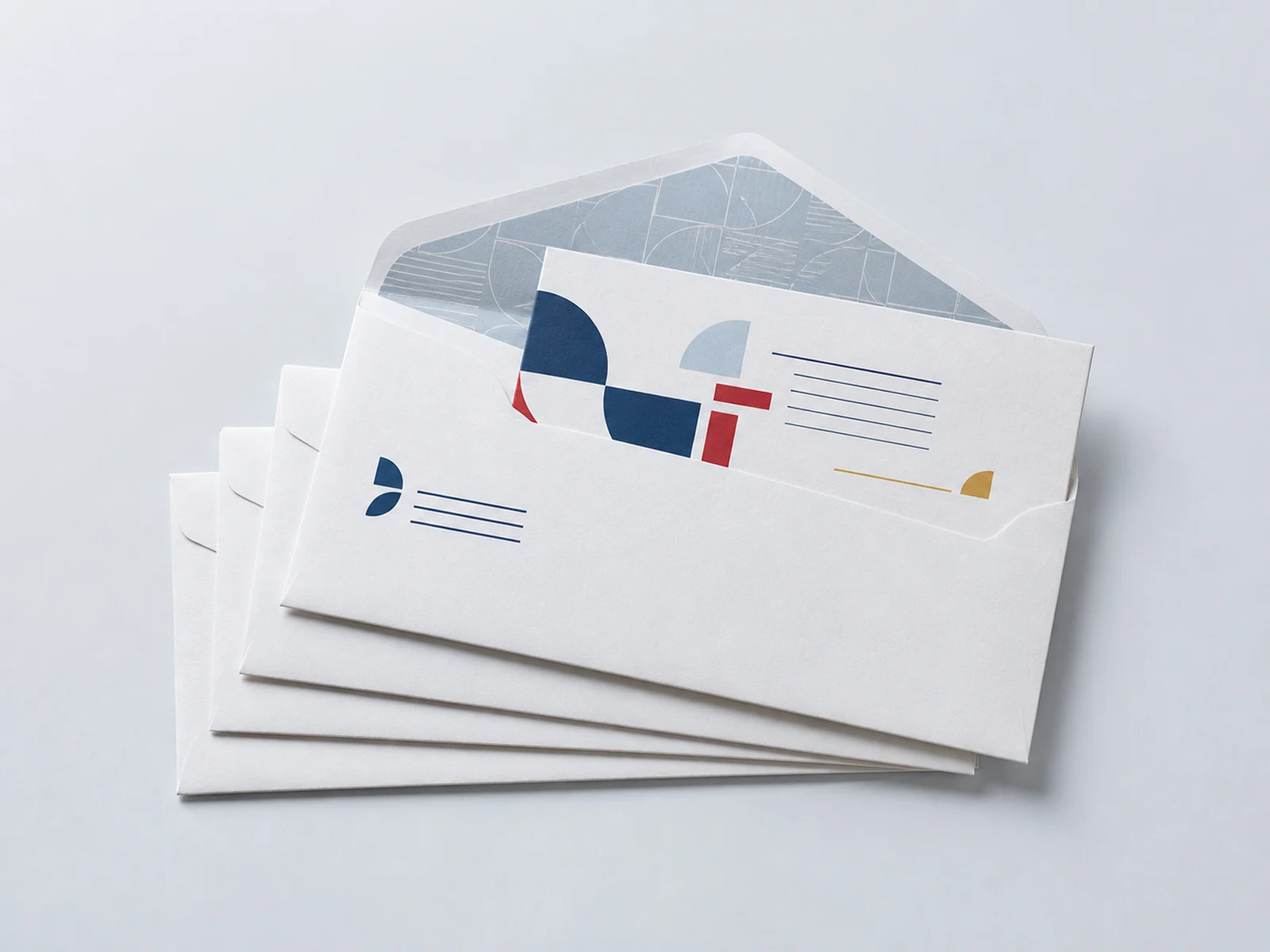 Printed envelopes fanned to show a return address block and a printed flap liner