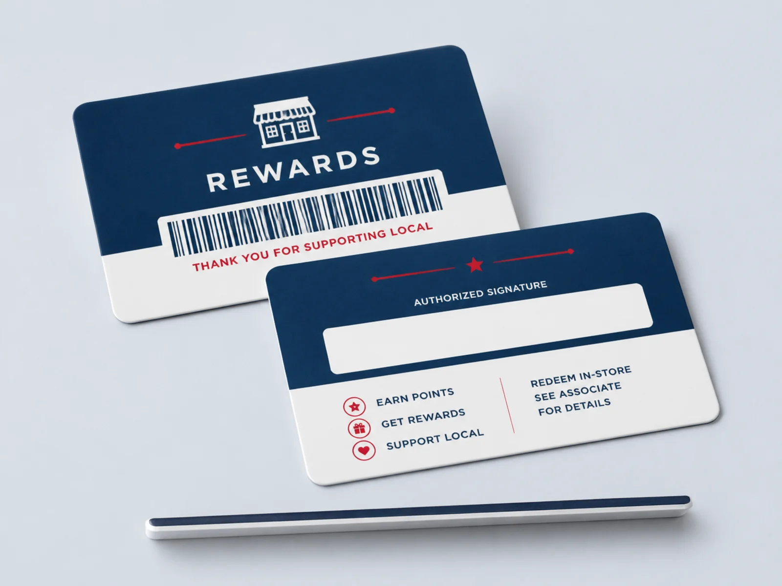 The back of a plastic card showing a magnetic stripe, barcode, and QR block