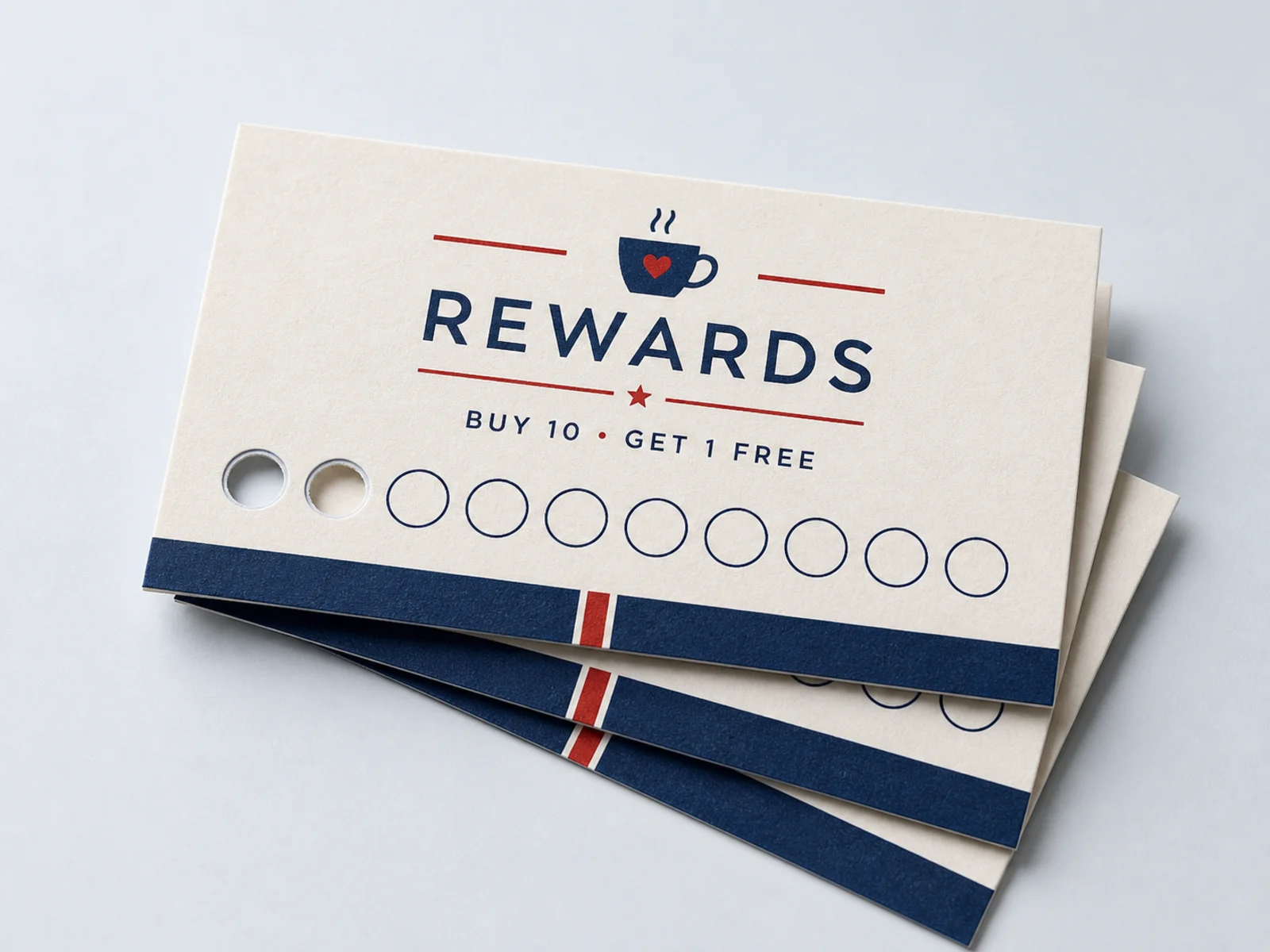 A stack of paper punch cards with punched reward circles