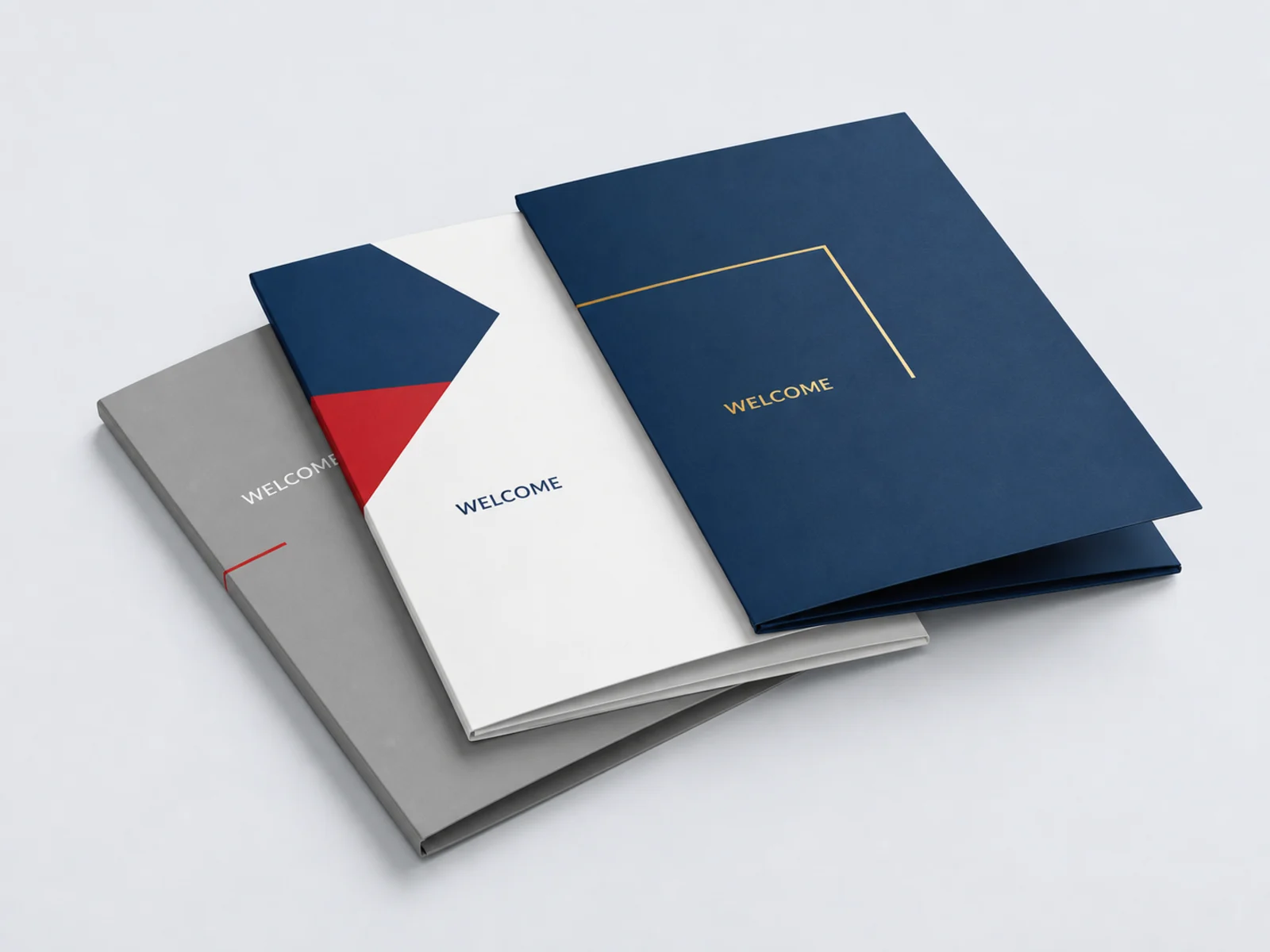 A closed folder lying flat beside one standing on its loaded spine