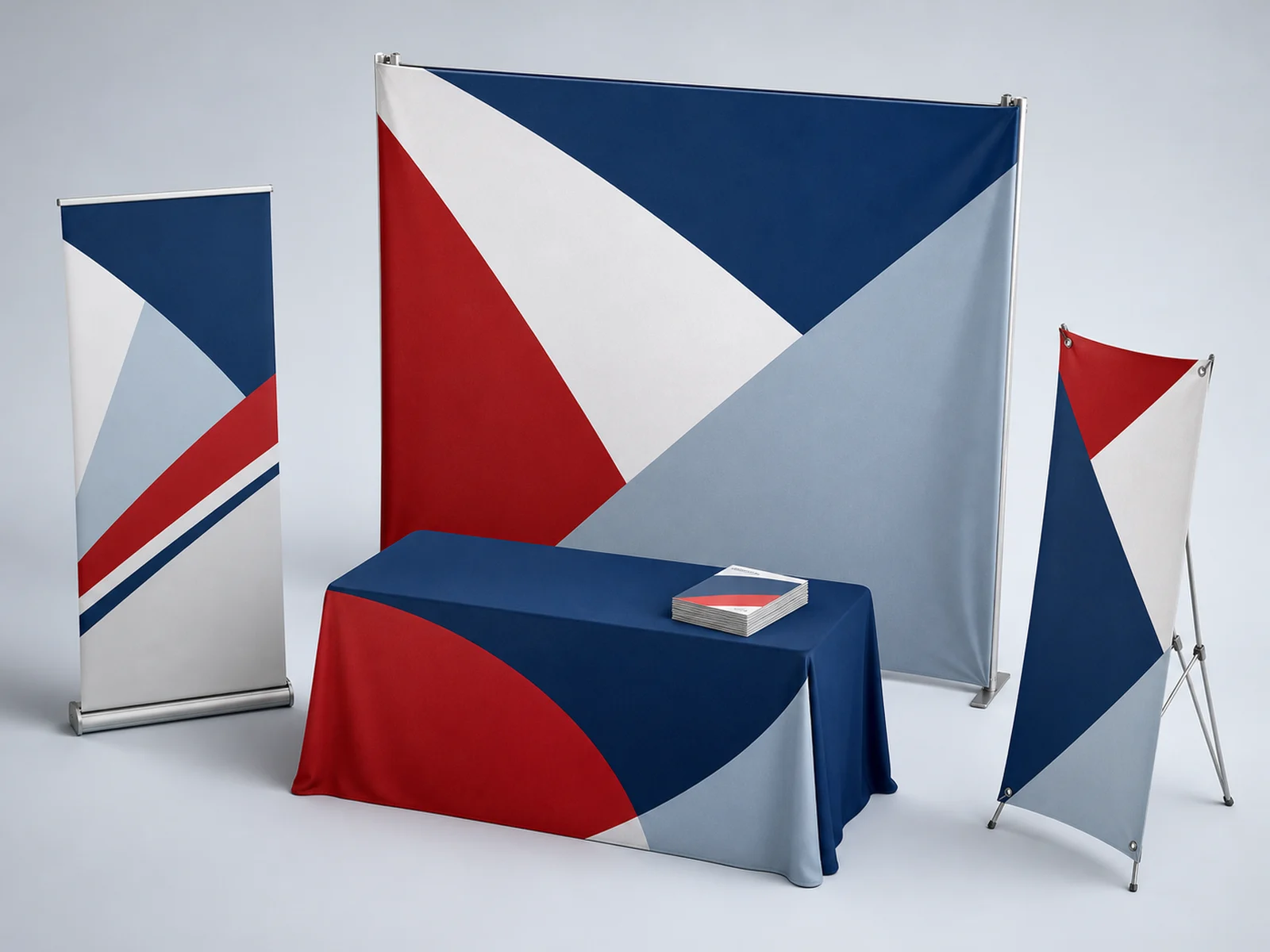 A full booth with a backdrop, retractable stand, table throw, and literature