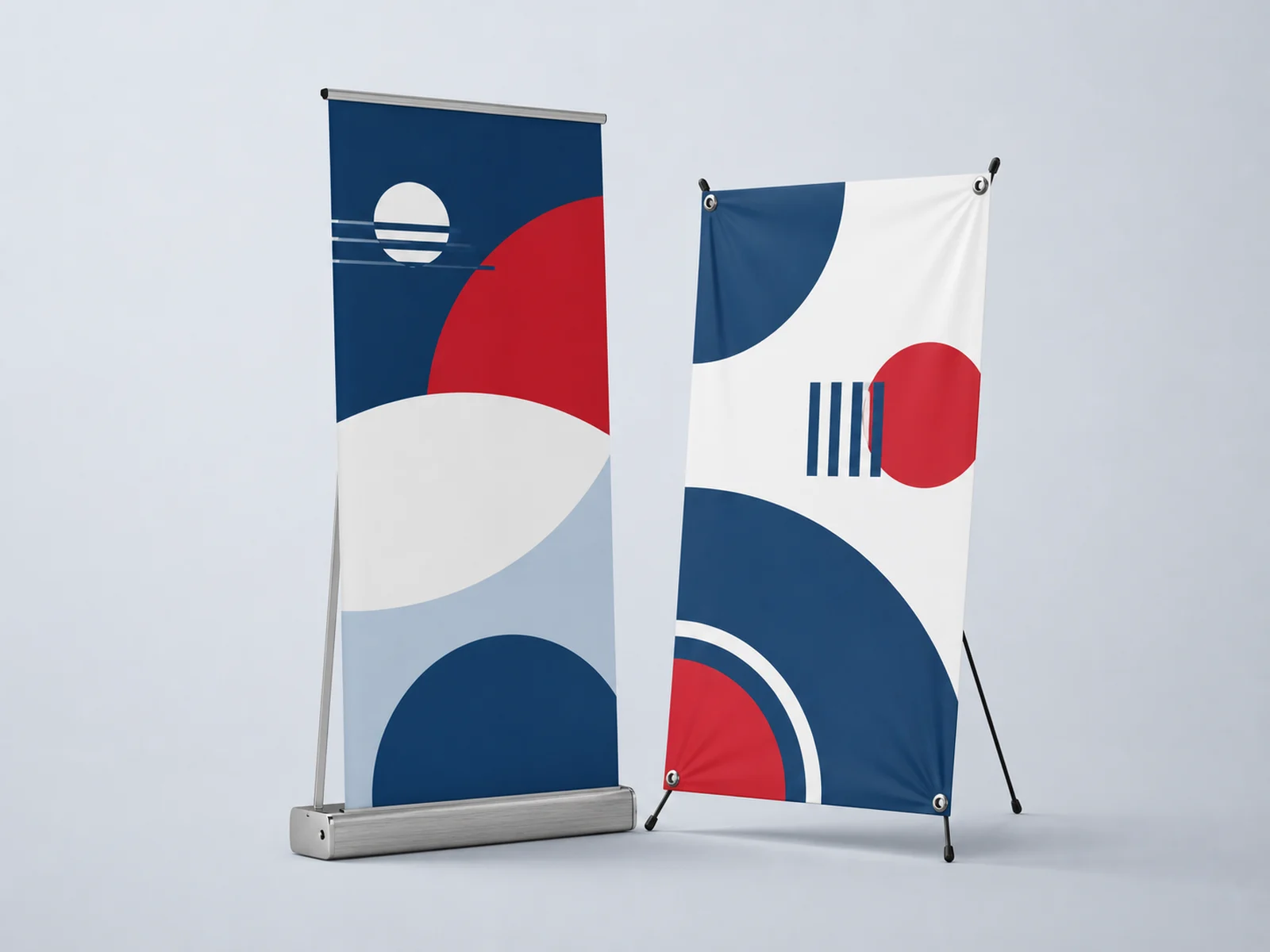 A retractable banner stand beside an x-stand banner