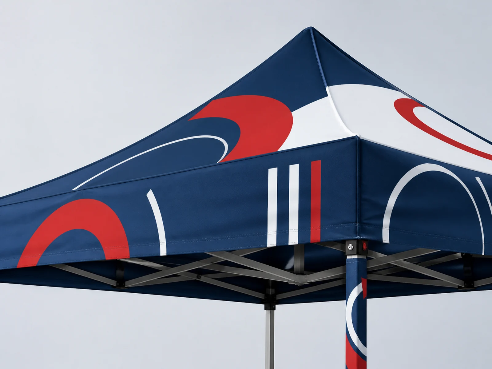 The printed corner of a pop up canopy tent showing the canopy, valance, and frame