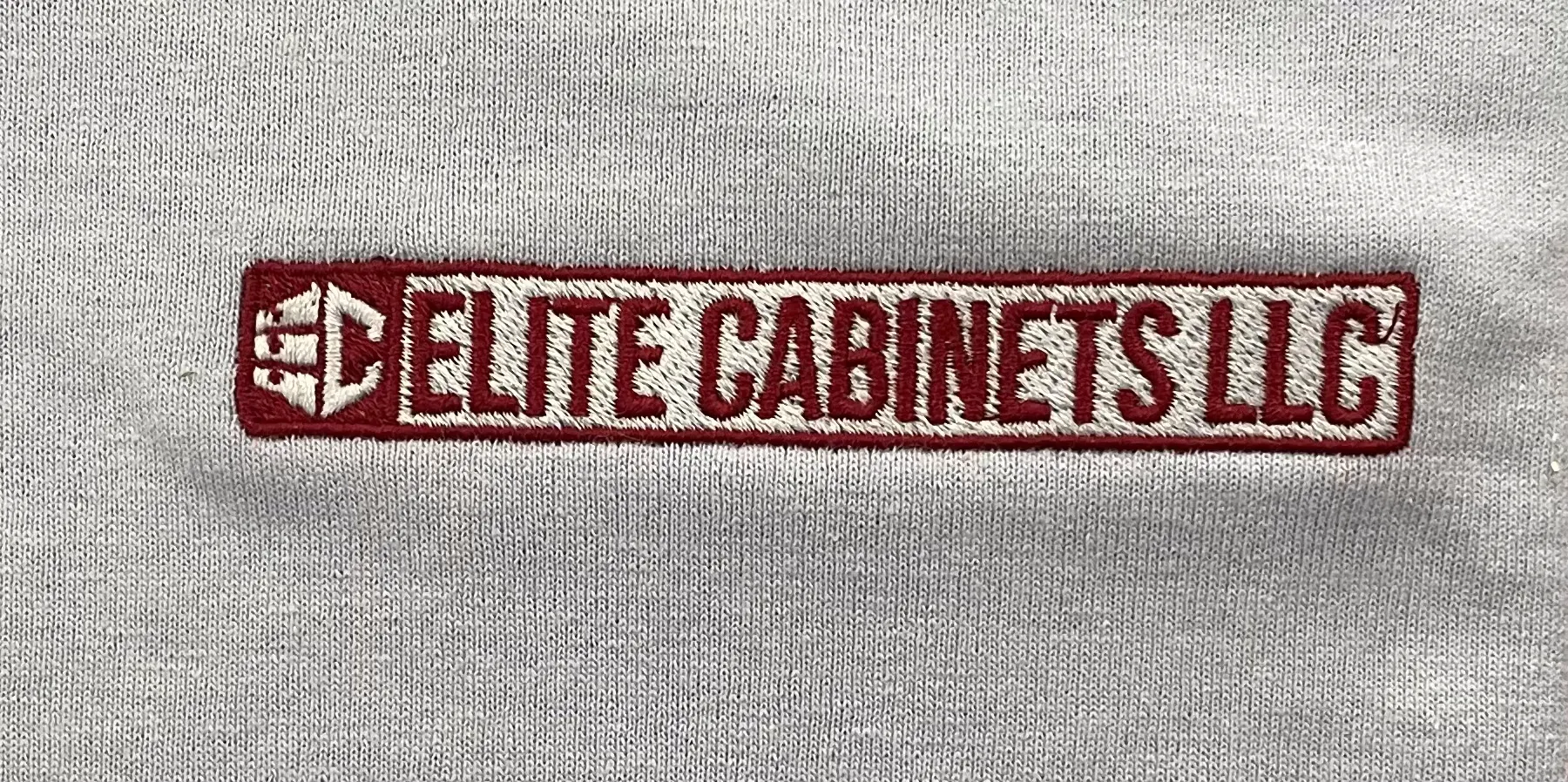 Light blue shirt with red and white embroidery
