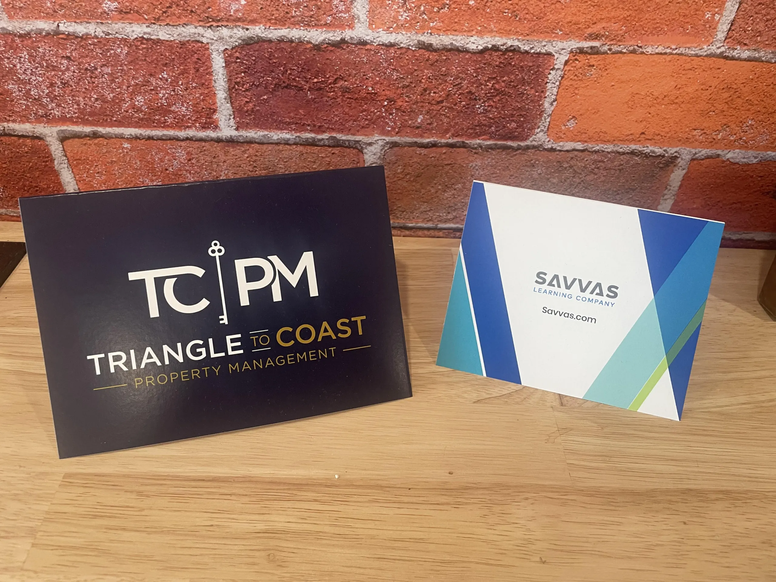 Two greeting card samples sitting on a desk.